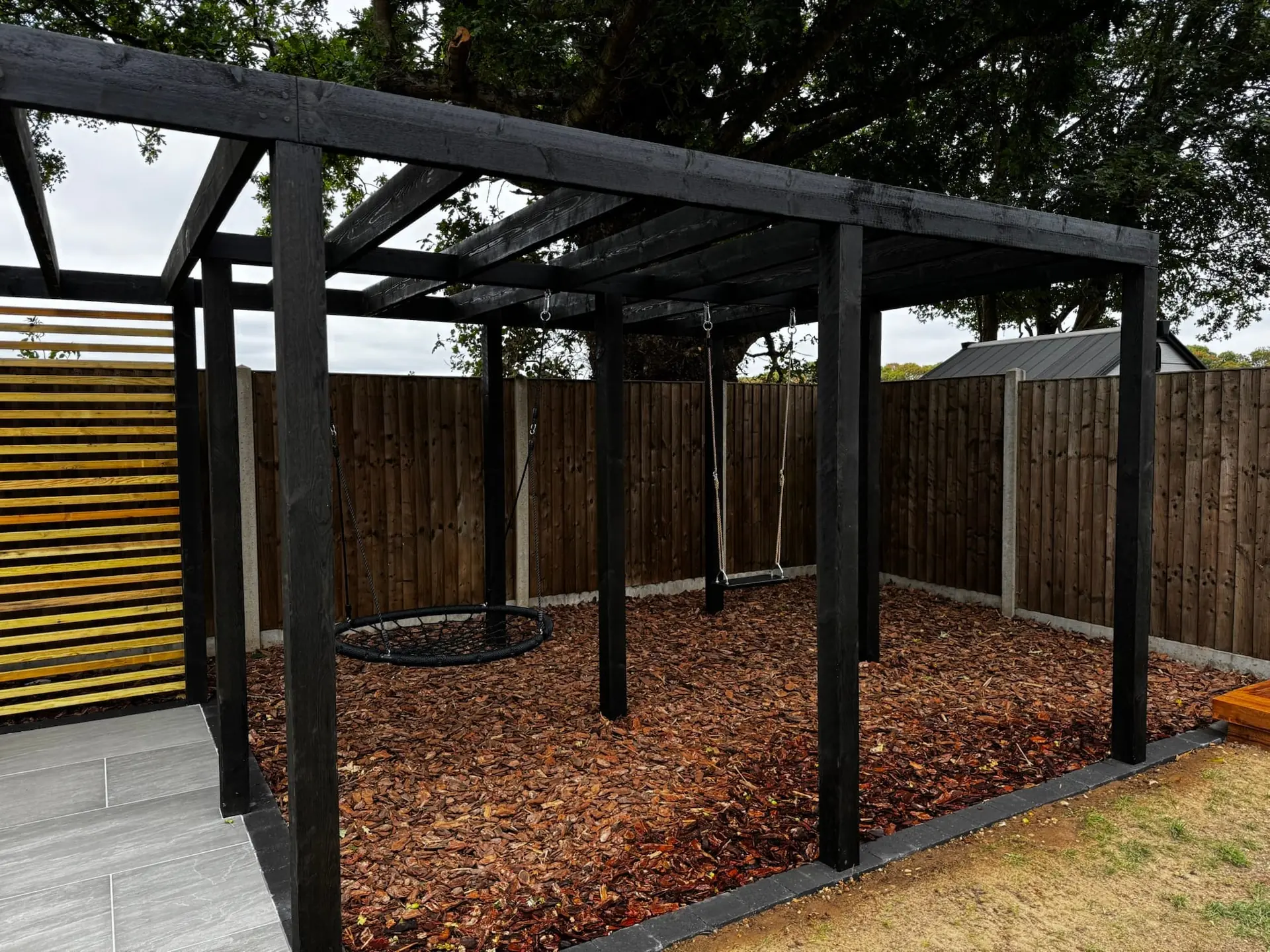 Black timber pergola and patio, Rackheath